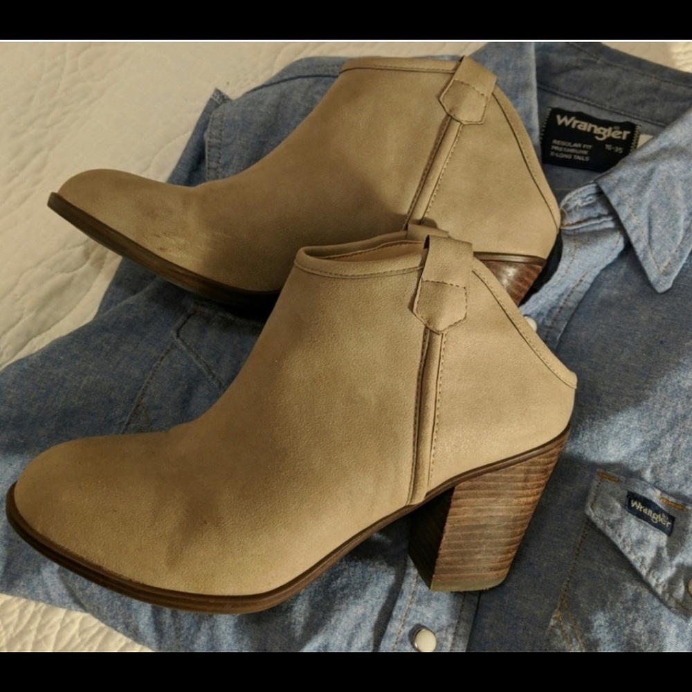 Tan open-back mules.